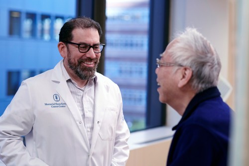 Luis Diaz Jr., MD with a patient