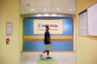 Photo of person walking in front of MSK Kids sign