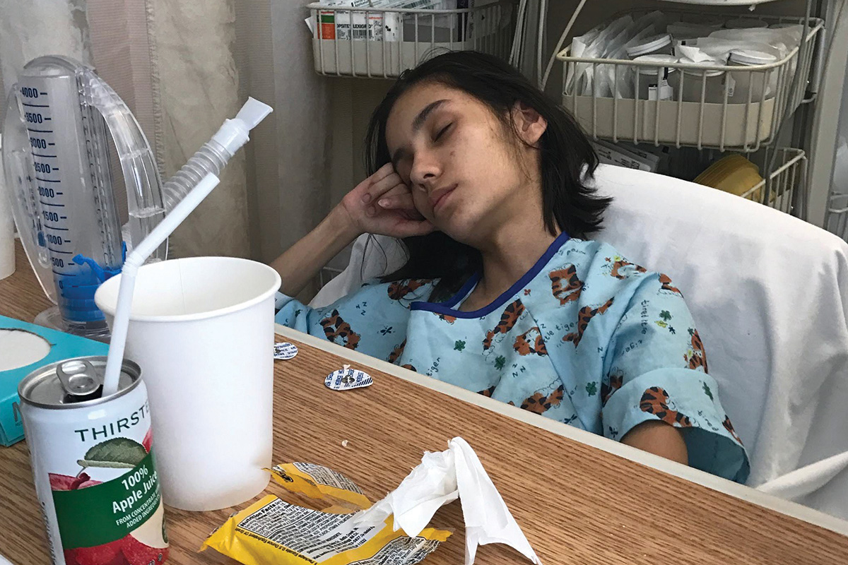 Giovanna Whitting rests in a hospital bed
